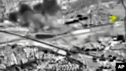 In this photo made from the footage taken from Russian Defense Ministry official web site on Oct. 2, 2015 a bomb explosion is seen in Syria. 