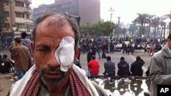 Man injured in clashes between Egyptian police and protesters angry at army's continuing political influence in Cairo, November 20, 2011.