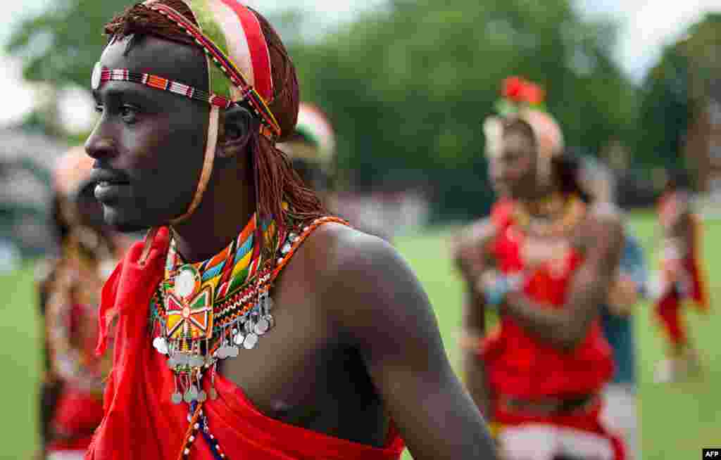 Members of the Maasai Warrior team leave the pitch after a friendly match against the Charity VIII team during opening ceremony activities of the &#39;Last Man Stands&#39; World Championships at Lords Nursery ground in London, Aug. 25, 2013.