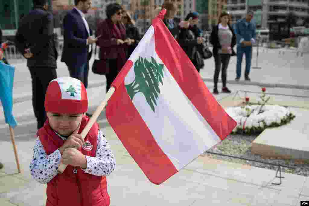 A young boy stands in front of the grave of Rafik Hariri, the father of Prime Minister Saad Hariri, as Lebanon marks its Independence Day in Beirut, Nov. 22, 2017.