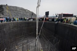 FILE - Turkish leaders and their wives attend a groundbreaking ceremony for the construction of a third bridge over the Bosporus Strait connecting the Asian and European sides of Istanbul, Turkey, May 29, 2013.