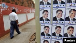FILE - Election posters of the opposition Renamo party in Mozambique's capital, Maputo, Oct., 2009.