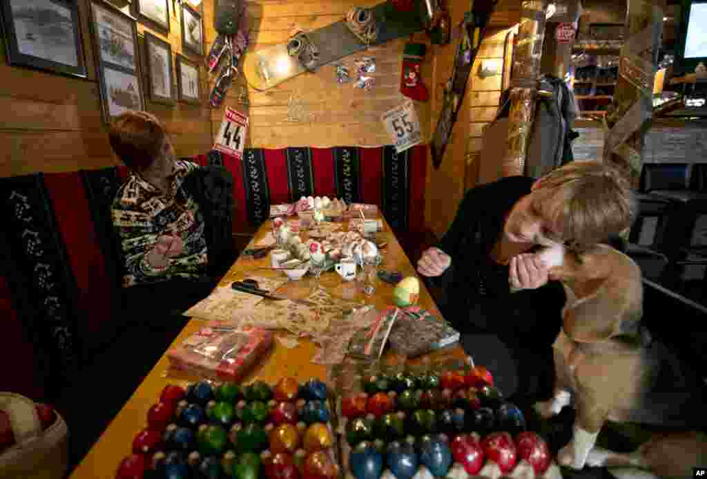 Kosovo Serb women decorate Easter eggs for the upcoming Orthodox Easter in village of Brezovica, 55 miles northwest of Pristina. As part of tradition women decorate hundreds of eggs and distribute them to worshipers.