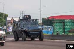A police armored personnel carrier patrols in Kinshasa, DRC, Nov. 30, 2017, during a day of protest called for by the opposition parties to demand the departure of President Kabila.