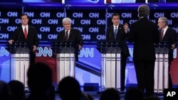 Republican presidential candidates, from left, former Pennsylvania Sen. Rick Santorum, former House Speaker Newt Gingrich, former Massachusetts Gov. Mitt Romney and Rep. Ron Paul, R-Texas, look toward moderator Wolf Blitzer of CNN as they participate in t