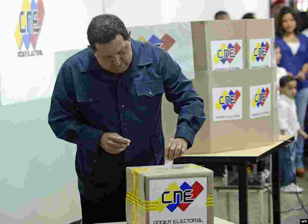 Venezuelan President Hugo Chavez casts his vote in Caraca during presidential elections. 