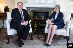 FILE - U.S. Secretary of State Mike Pompeo meets with Britain's Prime Minister Theresa May, right, at 10 Downing Street in central London, May 8, 2019.