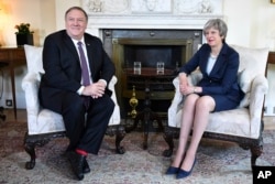 U.S. Secretary of State Mike Pompeo meets with Britain's Prime Minister Theresa May, right, at 10 Downing Street in central London, May 8, 2019.