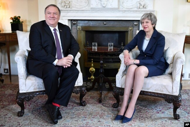 FILE - U.S. Secretary of State Mike Pompeo meets with Britain's Prime Minister Theresa May, right, at 10 Downing Street in central London, May 8, 2019.