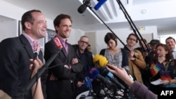 (From L) Romain Striffing, brother of Albane Moulin-Fournier, and Nicolas Moulin-Fournier, brother of Tanguy and Cyril Moulin-Fournier, speak to journalists in Paris, on April 19, 2013 after relase.
