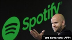FILE: Daniel Ek, CEO of Swedish music streaming service Spotify, gestures as he makes a speech at a press conference in Tokyo on September 29, 2016. 
