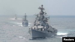 FILE - Indian naval warships are seen in the waters off the southern Indian port of Chennai.