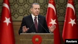 Tayyip Erdogan addresses a gathering of local leaders in Ankara, Turkey, Dec. 1, 2016.