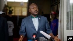 FILE - President Pierre Nkurunziza makes a brief statement at the presidential palace in Bujumbura, Burundi, May 17, 2015. 