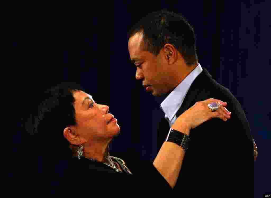 February 19: Golfer Tiger Woods hugs his mother Kultida Woods during his first public statement to a small gathering of reporters and friends at the headquarters of the U.S. PGA Tour in Ponte Vedra Beach, Florida, February 19, 2010. (Reuters)