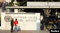 FILE - United Nations security officers stand guard outside the U.N. European headquarters in Geneva, Switzerland, Dec. 10, 2015. 