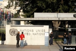 FILE - United Nations security officers stand guard outside the U.N. European headquarters in Geneva, Switzerland, Dec. 10, 2015.