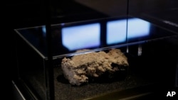 The only remaining piece of the 130 ton, 250-meter-long fatberg, removed from the sewers in the Whitechapel area of east London in the latter months of 2017, is displayed at the Museum of London, Feb. 8, 2018. 