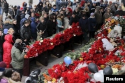 People gather to commemorate the victims of the crashed Flight FZ981, a Boeing 737-800 operated by Dubai-based budget carrier FlyDubai, outside the airport of Rostov-on-Don, Russia, March 20, 2016.