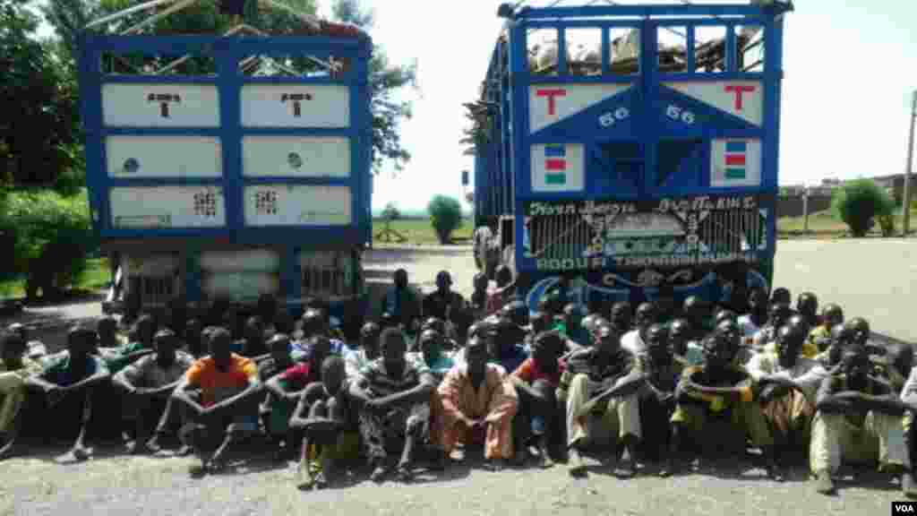 A group of Boko Haram fighters who recently surrendered with their equipment to the Nigerian military near Maiduguri. 