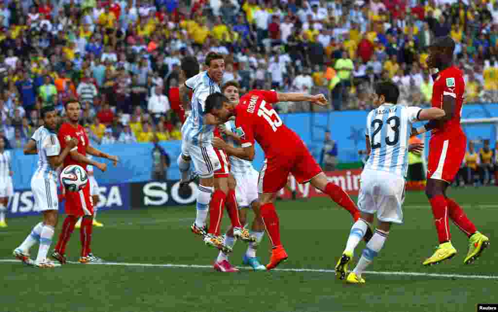 Switzerland's Blerim Dzemaili's header hits the goal post during second half extra time in the round of 16 game between Argentina and Switzerland at the Corinthians arena in Sao Paulo, July 1, 2014.