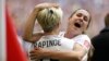 United States' Heather O'Reilly, right, hugs Megan Rapinoe (15) after the U.S. beat Japan 5-2 in the FIFA Women's World Cup soccer championship in Vancouver, British Columbia, Canada, Sunday, July 5, 2015.