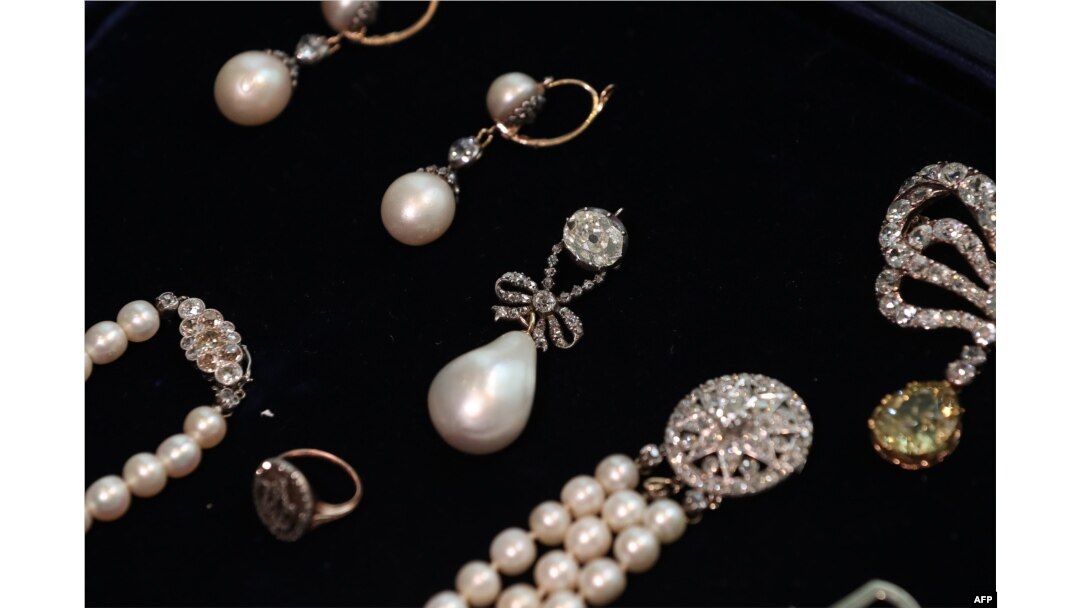 In this file photo taken on Oct. 19, 2018, the 'Queen Marie Antoinette's Pearl,' center, is pictured with other jewellery during a photocall for the sale of 'Royal Jewels from the Bourbon Parma Family.'