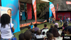 Members of the Safeguard Young People (SYP) perform at the Harare International Festival of the Arts in Harare, Zimbabwe, May 1, 2015. Their songs aim to educate adolescents and young people on sexual reproductive health. (Sebastian Mhofu/VOA)