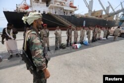 FILE - Yemen's Houthi movement forces are seen during withdrawal from Saleef port in Hodeidah province, Yemen, May 11, 2019.