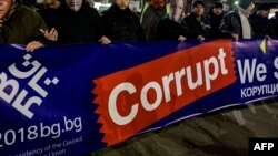 Bulgarian anti-corruption protesters march during a demonstration in downtown Sofia, Jan. 11, 2018.