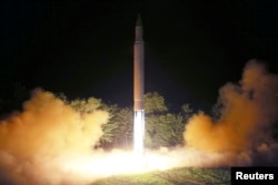 FILE - Intercontinental ballistic missile (ICBM) Hwasong-14 is pictured during its second test-fire in this undated picture provided by KCNA in Pyongyang on July 29, 2017.