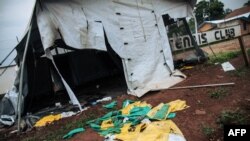 A picture taken on Dec. 27, 2018, shows protective equipments for Ebola care left on the ground next to ransacked tents by demonstrators at the Ebola transit center in Beni, DR Congo.