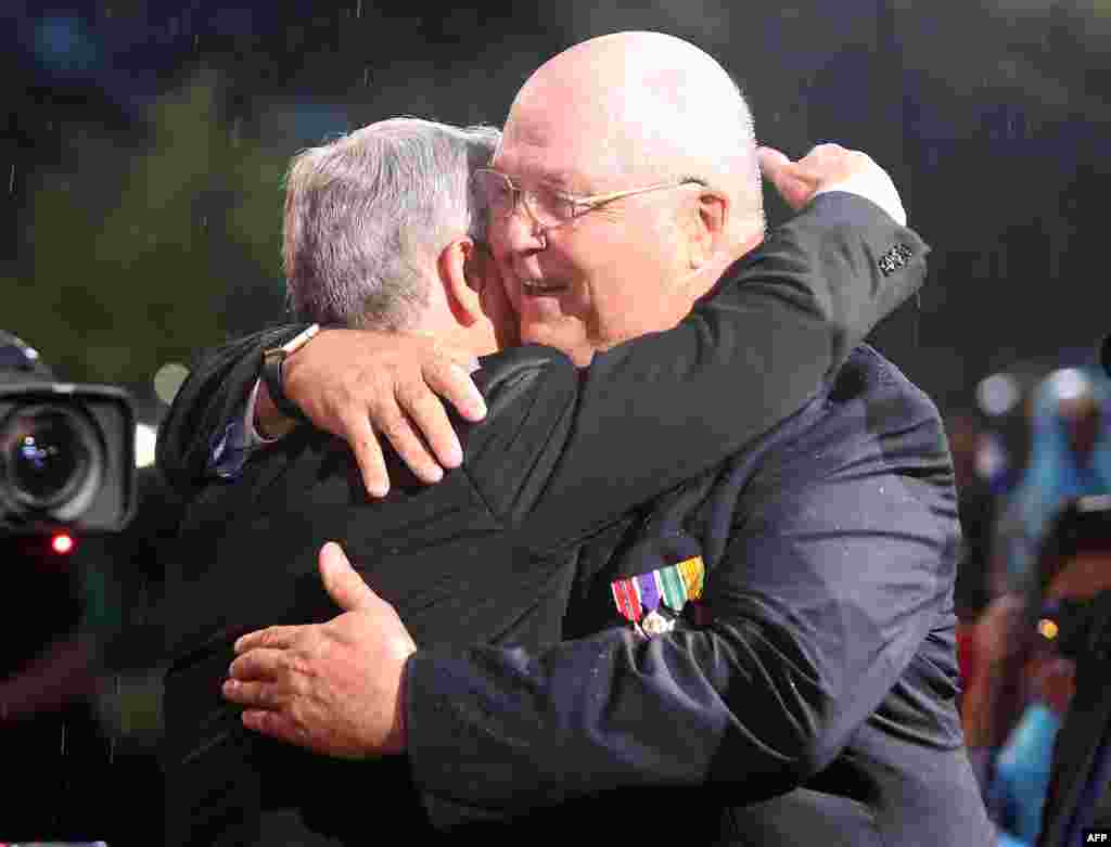 Actor and co-host Gary Sinise hugs veteran Jack Farley after paying tribute to him at the 27th National Memorial Day Concert in Washington. Farley, who was wounded in combat during the Vietnam War, received four bronze stars and two purple hearts.
