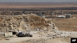 A frontline rebel position overlooks the town of Bir al-Ghanam in western Libya, August 5, 2011