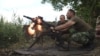 FILE - Members of Ukraine's military fire a grenade launcher in this undated image. That military has asked the United States for 'lethal defensive weapons." A revised GOP proposal calls for "appropriate assistance."