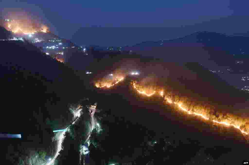 Wildfires burn in hills around New Tehri at Bourari in the Indian state of Uttarakhand.