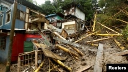 Houses damaged by a mudslide are seen during heavy rains of Tropical Storm Nate that affects the country in San Jose, Costa Rica, Oct. 5, 2017.