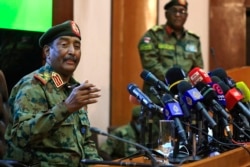 Sudan's top army general Abdel Fattah al-Burhan speaks during a press conference at the General Command of the Armed Forces in Khartoum on Oct. 26, 2021.
