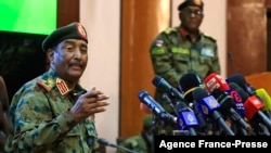FILE - Sudan's top army general Abdel Fattah al-Burhan speaks during a press conference at the General Command of the Armed Forces in Khartoum on Oct. 26, 2021.