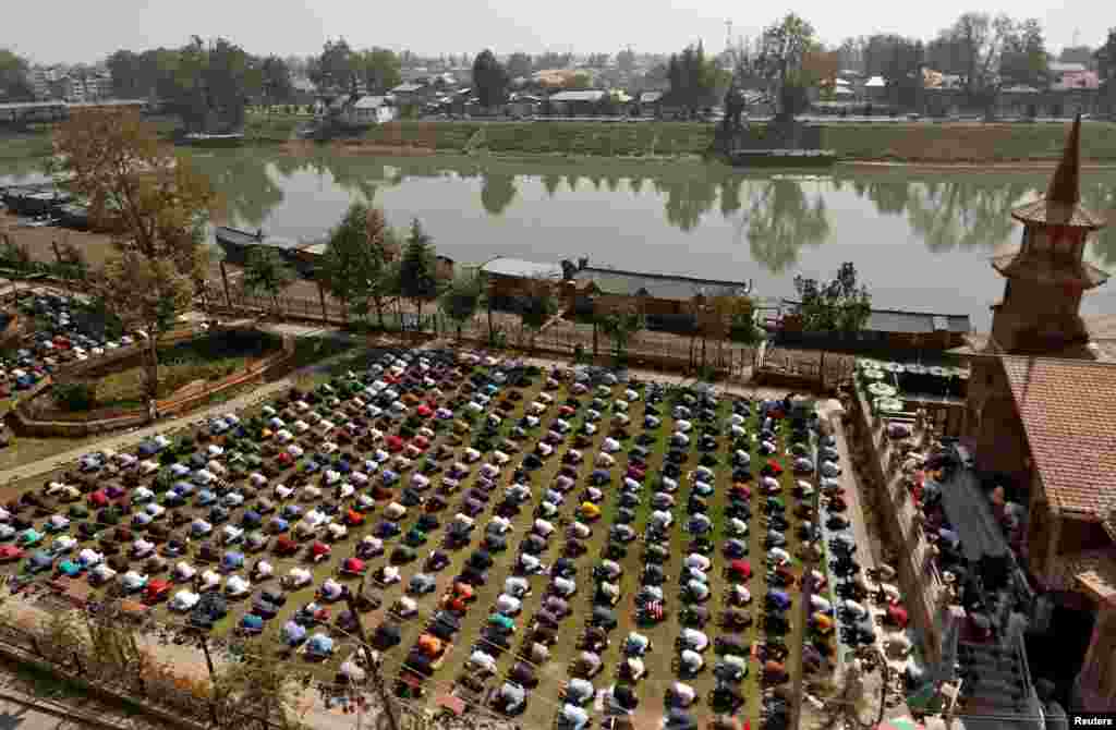 Muslims offer Friday prayers outside a mosque, amidst the coronavirus disease outbreak, in Srinagar.