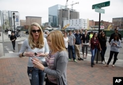 Karen Snyder, right, and Kathryn Vanwie react to the announcement of the death penalty verdict for Dzhokhar Tsarnaev outside the John Joseph Moakley United States Courthouse in Boston, May 15, 2015.