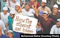 FILE - Islamist protesters demand public execution of the country's atheist bloggers, whom they accuse of humiliating and ridiculing Islam, the Koran and Prophet Mohammad, in Chittagong, Bangladesh, in March 2013.