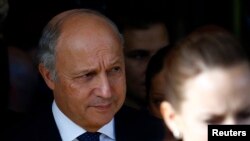 French Foreign Minister Laurent Fabius leaves the Intercontinental hotel on the third day of closed-door nuclear talks with Iran in Geneva November 9, 2013. 