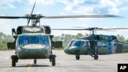 FILE - The Colombian Army flew two S-70i BLACK HAWK helicopters to Colombia following acceptance from Sikorsky&apos;s West Palm Beach, Florida, facility in late August.