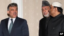 President of Turkey Abdullah Gul, left, and his counterparts Hamid Karzai of Afghanistan, center, and Asif Ali Zardari of Pakistan arrive for a Turkey-Afghanistan-Pakistan summit in Istanbul, Turkey, Friday, Dec. 24, 2010.