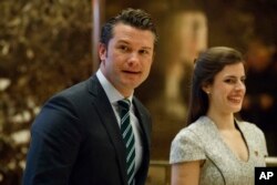 FILE - Pete Hegseth, former executive director of Vets For Freedom, walks to an elevator for a meeting with President-elect Donald Trump at Trump Tower in New York, Dec. 15, 2016.