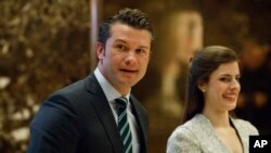 FILE - Pete Hegseth, former executive director of Vets For Freedom, walks to an elevator for a meeting with President-elect Donald Trump at Trump Tower in New York, Dec. 15, 2016.