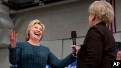 Democratic presidential candidate Hillary Clinton reacts as former Secretary of State Madeleine Albright introduces Clinton at a campaign event at Rundlett Middle School, in Concord, N.H., Saturday Feb. 6, 2016.