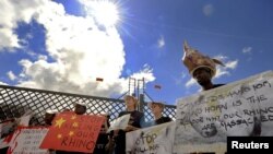 Activists protest Rhinoceros poaching outside the Chinese embassy in Pretoria, South Africa, March 29, 2012.