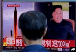 A man watches a TV screen showing file footage of North Korea's missile launch and North Korean leader Kim Jong Un, at the Seoul Railway Station in Seoul, South Korea, Sept. 15, 2017. The threat poses by Pyongyang's nuclear and missile programs will be high on U.S. Defense Secretary Jim Mattis' agenda during his Asia trip.